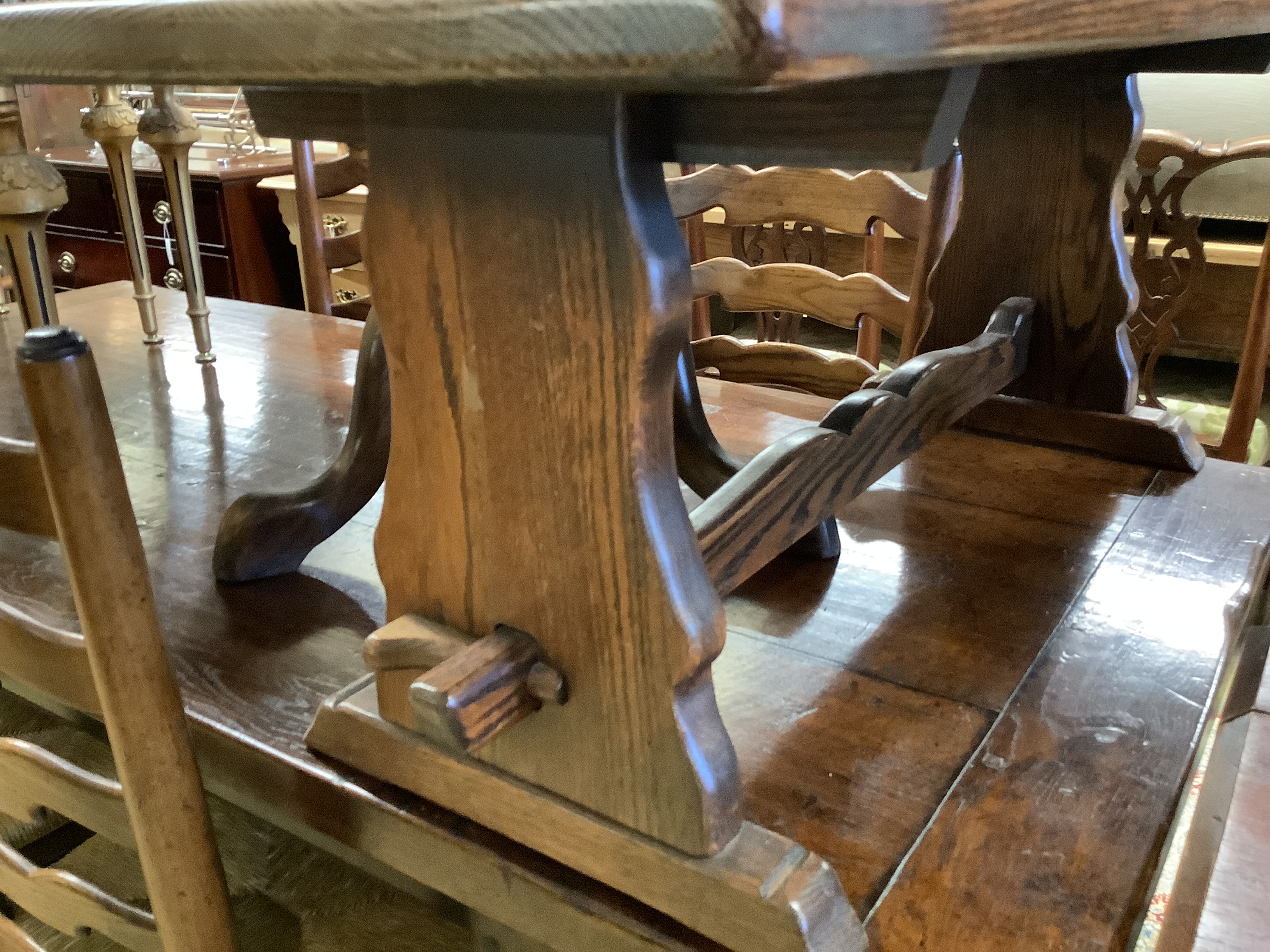 A circular mahogany occasional table on tripod base, diameter 60cm, height 70cm together with a rectangular oak low occasional table, width 106cm, height 42cm